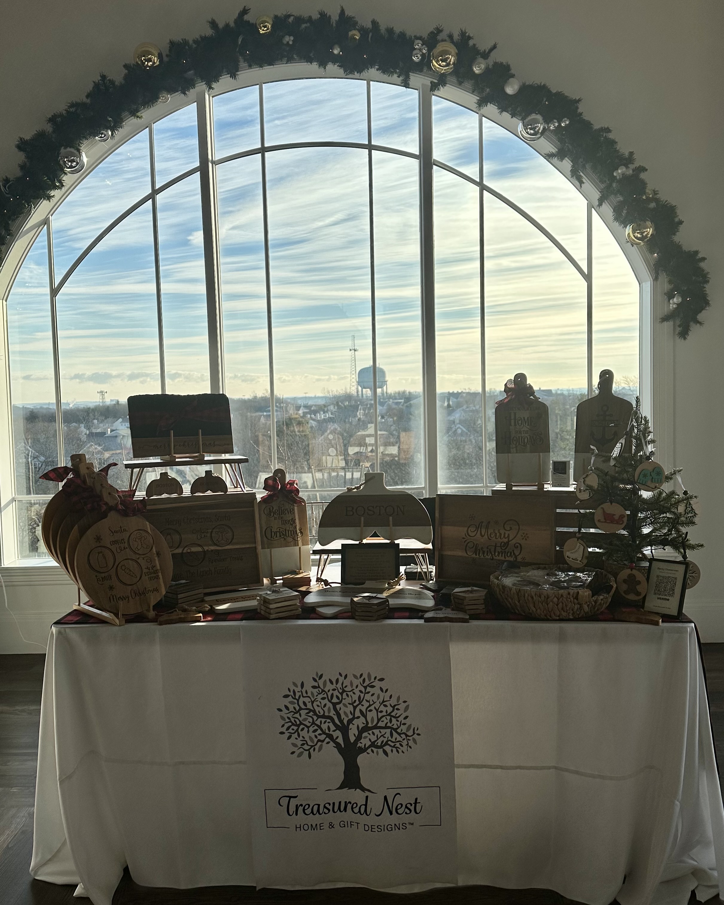 Treasured Nest Designs product display at a craft fair