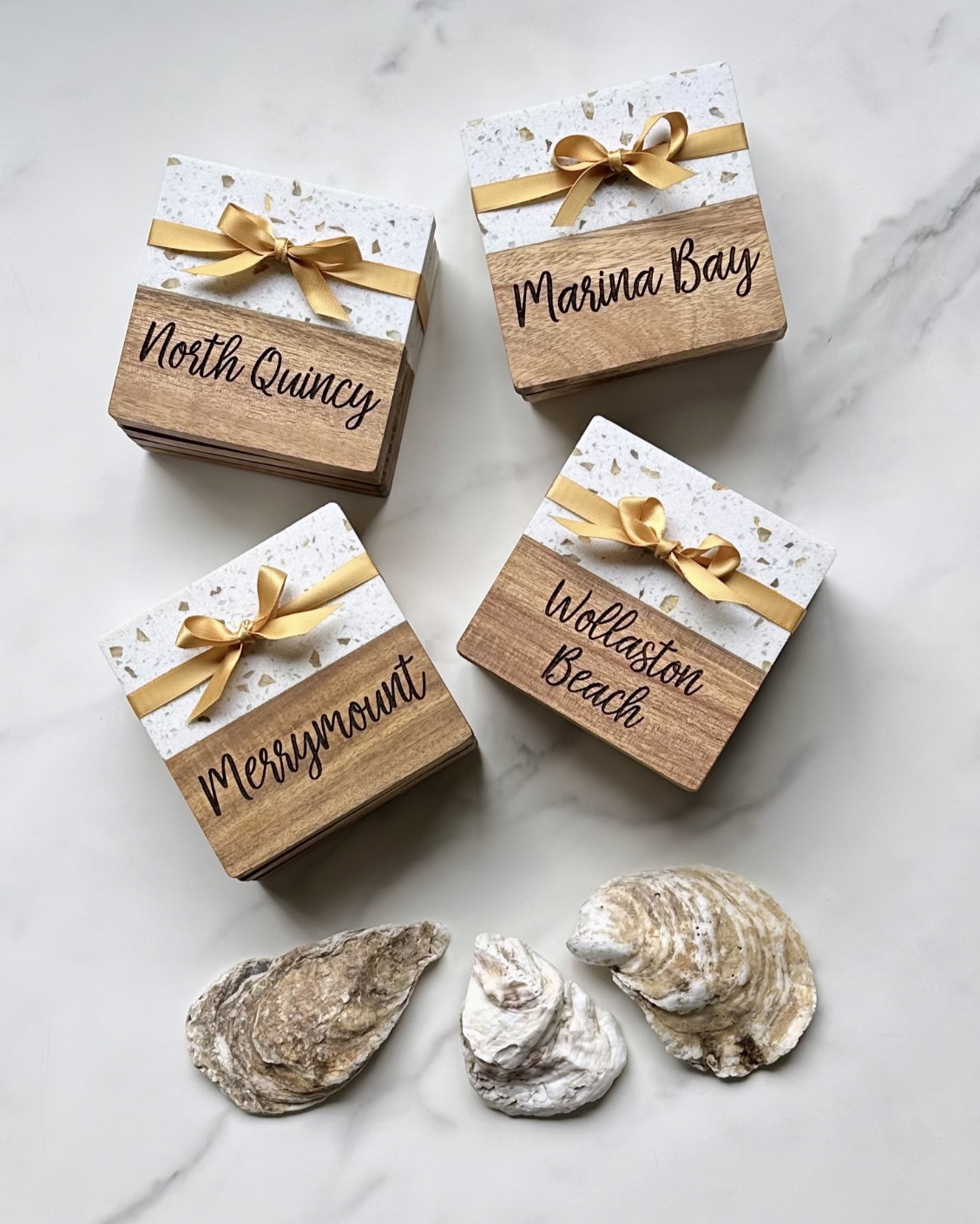 Terrazzo and wood coaster gift sets with neighborhood names